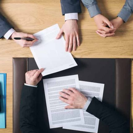 Divorce lawyer and client signing paperwork in Sugar Land, Texas